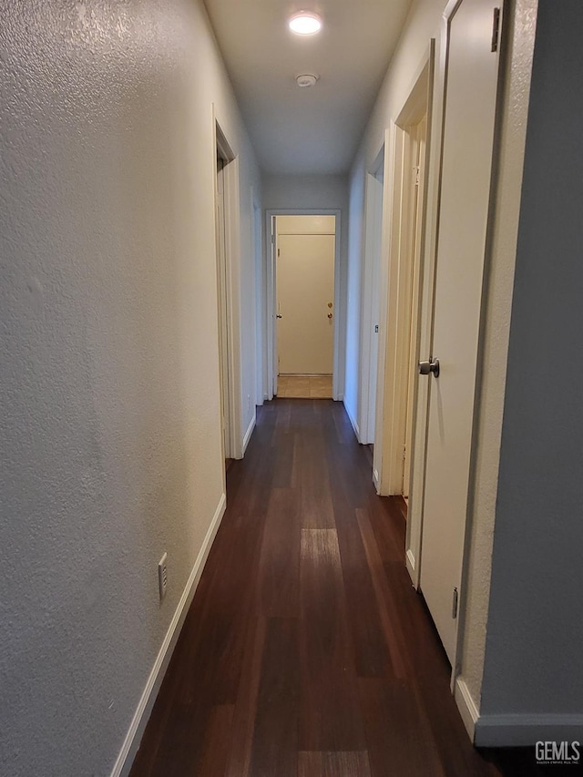 11511 Bay Meadows Ln, Bakersfield, CA 93312 - hallway featuring dark wood finished floors and a textured wall