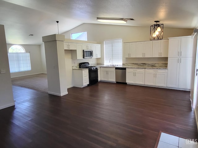 11511 Bay Meadows Ln, Bakersfield, CA 93312 - kitchen with appliances with stainless steel finishes, lofted ceiling, plenty of natural light, white cabinetry, and pendant lighting