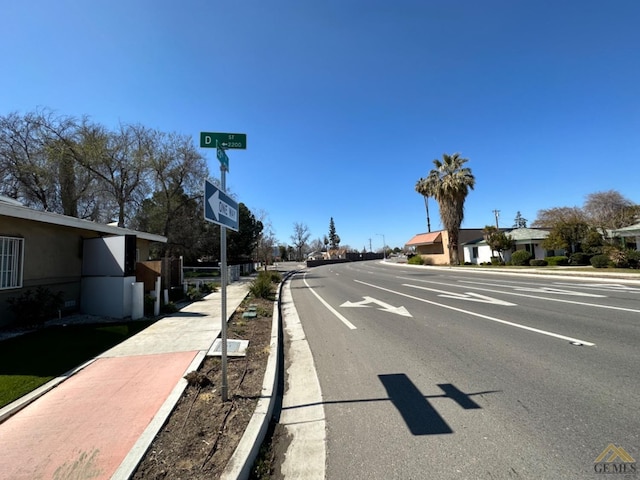 view of road featuring sidewalks and curbs