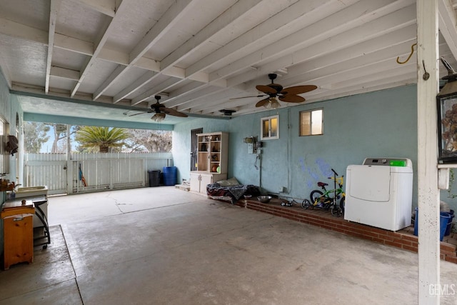 view of patio / terrace with a gate, washer / clothes dryer, ceiling fan, and fence