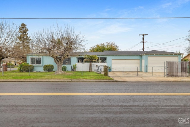 ranch-style house with a fenced front yard, a front lawn, concrete driveway, and stucco siding