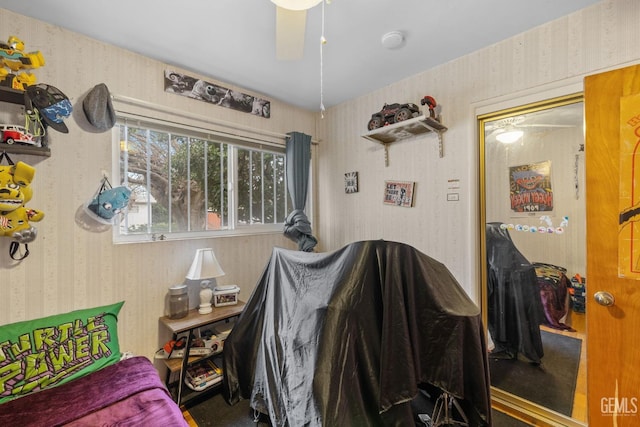 bedroom with wallpapered walls