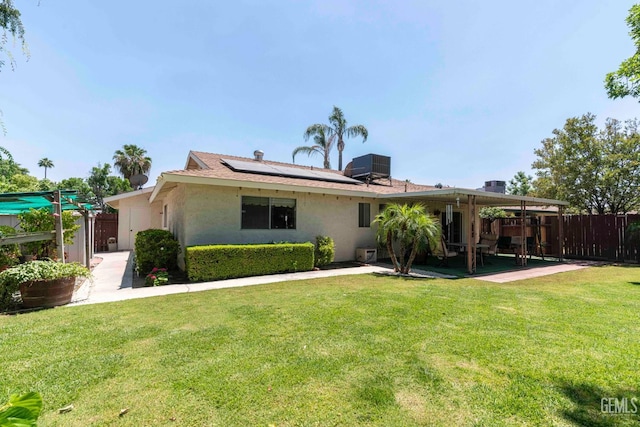 6012 Cumin Ln, Bakersfield, CA 93309 - view of front of house featuring solar panels, stucco siding, a patio, and central AC unit