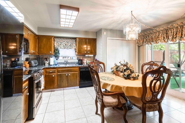 6012 Cumin Ln, Bakersfield, CA 93309 - kitchen featuring black appliances, a sink, brown cabinetry, a chandelier, and backsplash