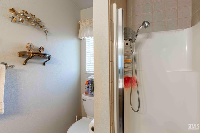 6012 Cumin Ln, Bakersfield, CA 93309 - bathroom featuring a shower with door and toilet
