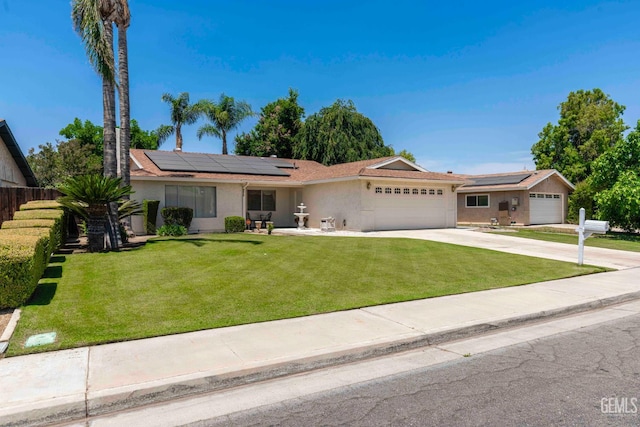 6012 Cumin Ln, Bakersfield, CA 93309 - ranch-style home featuring an attached garage, stucco siding, solar panels, and driveway