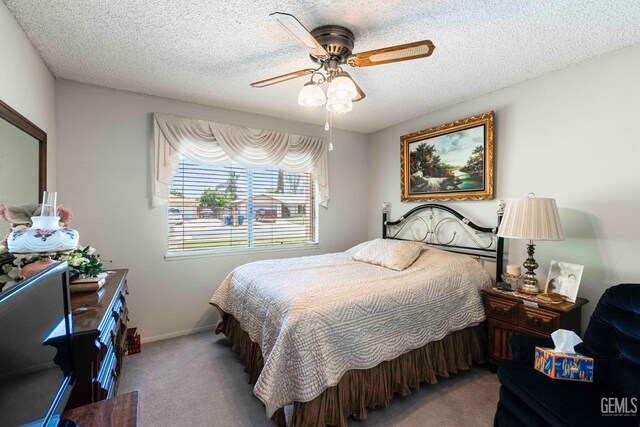 6012 Cumin Ln, Bakersfield, CA 93309 - carpeted bedroom with a textured ceiling, ceiling fan, and baseboards