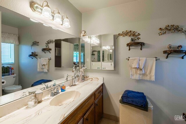 6012 Cumin Ln, Bakersfield, CA 93309 - bathroom featuring toilet and vanity