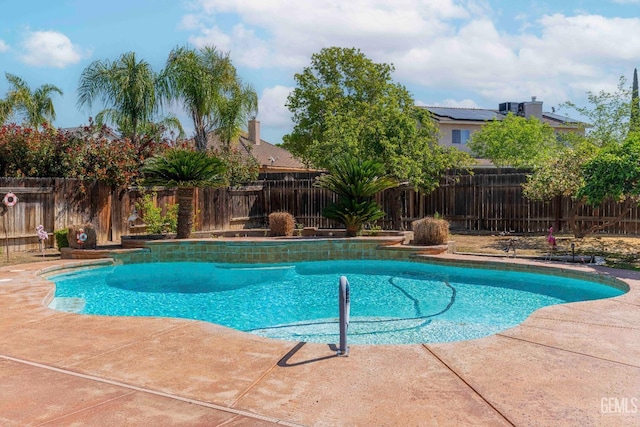view of swimming pool featuring a fenced backyard, a fenced in pool, and a patio area