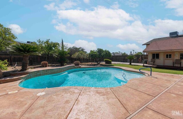 view of swimming pool featuring a patio, a fenced in pool, and a fenced backyard