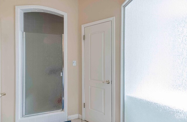 full bathroom with a shower stall