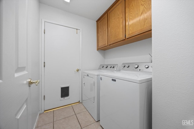 5836 S Greenhorn Mountain Ct, Bakersfield, CA 93313 - washroom with washing machine and clothes dryer, cabinet space, and light tile patterned floors