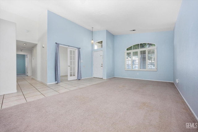 5836 S Greenhorn Mountain Ct, Bakersfield, CA 93313 - empty room featuring carpet, tile patterned flooring, and a high ceiling