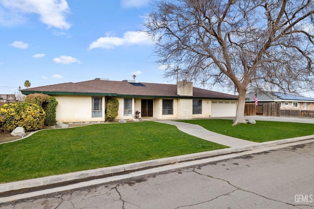 single story home with a garage and a front yard