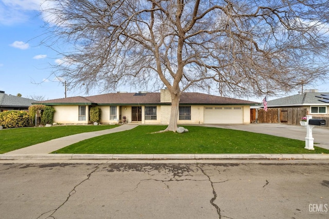 ranch-style home with a garage and a front lawn