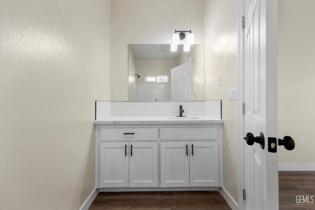 bathroom featuring vanity and hardwood / wood-style floors