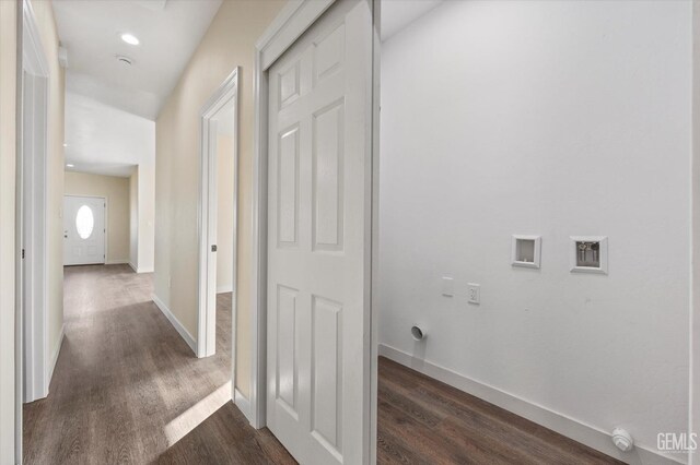 laundry room featuring dark wood-type flooring and washer hookup