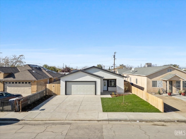 view of front of house featuring a garage and a front yard