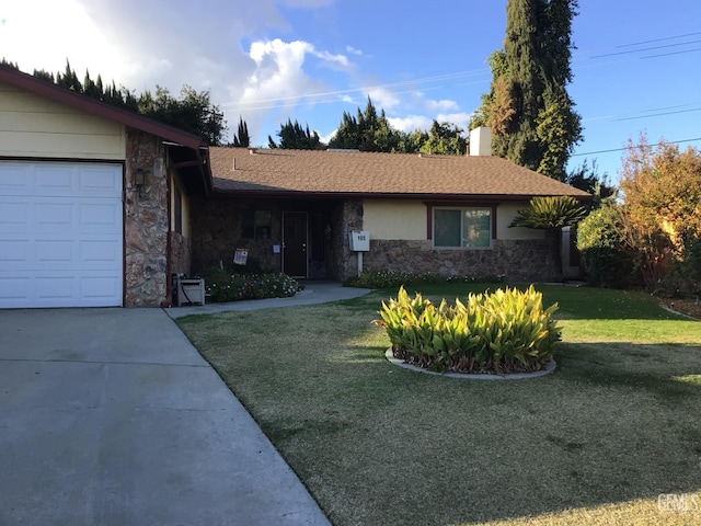 ranch-style house featuring a garage and a front lawn