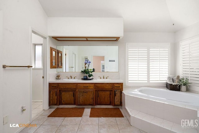 13019 Queen Palm Ct, Bakersfield, CA 93314 - bathroom with a garden tub, double vanity, and tile patterned floors