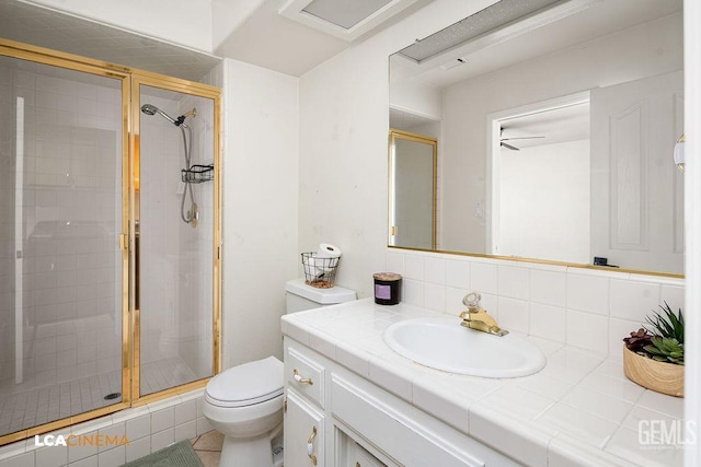 13019 Queen Palm Ct, Bakersfield, CA 93314 - full bathroom featuring vanity, a shower stall, and backsplash