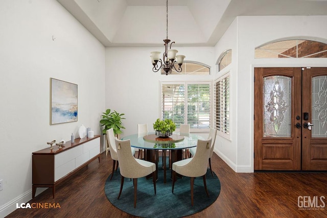 13019 Queen Palm Ct, Bakersfield, CA 93314 - dining area featuring a chandelier, wood finished floors, french doors, and vaulted ceiling