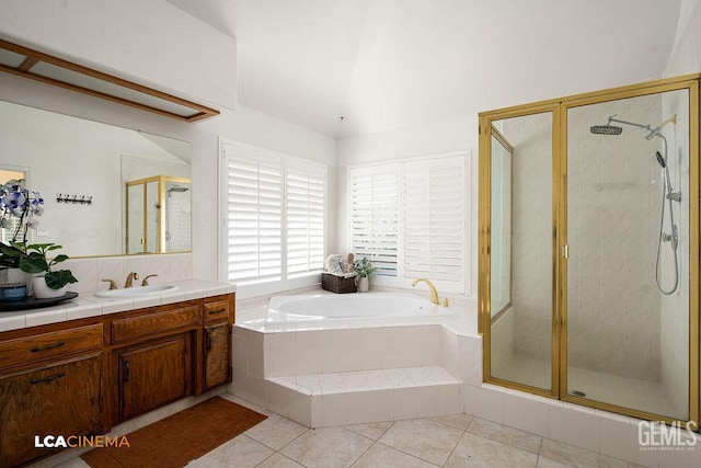 13019 Queen Palm Ct, Bakersfield, CA 93314 - full bath with vanity, a bath, a shower stall, tile patterned floors, and vaulted ceiling