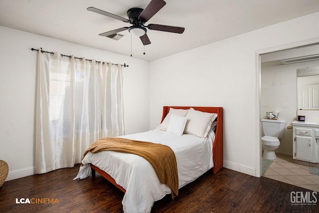 13019 Queen Palm Ct, Bakersfield, CA 93314 - bedroom with wood finished floors, ensuite bathroom, and a ceiling fan