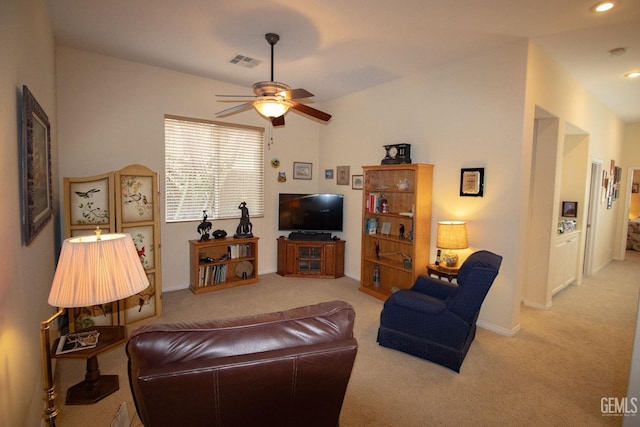 carpeted living room featuring ceiling fan