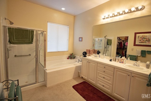 bathroom with plus walk in shower and vanity