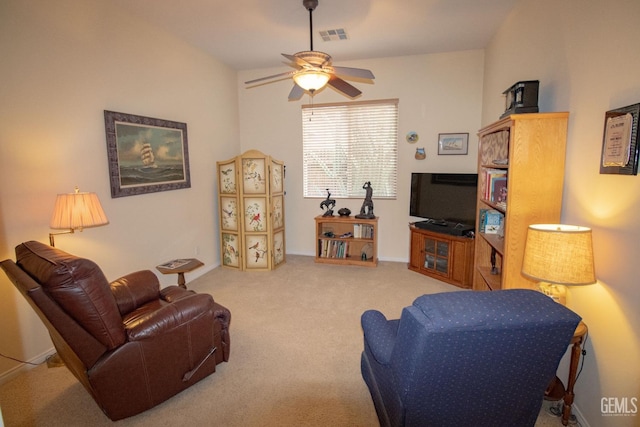 living room with carpet floors and ceiling fan