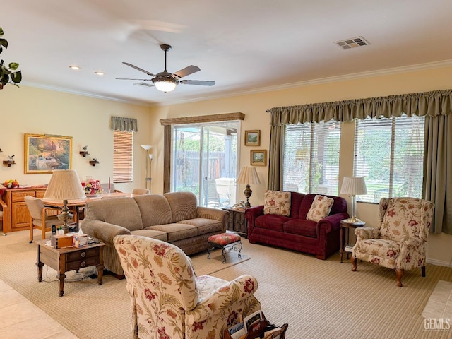 living room featuring ceiling fan and ornamental molding