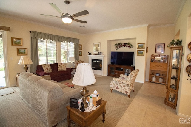 tiled living room featuring crown molding and ceiling fan