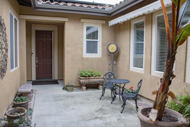 doorway to property with a patio area