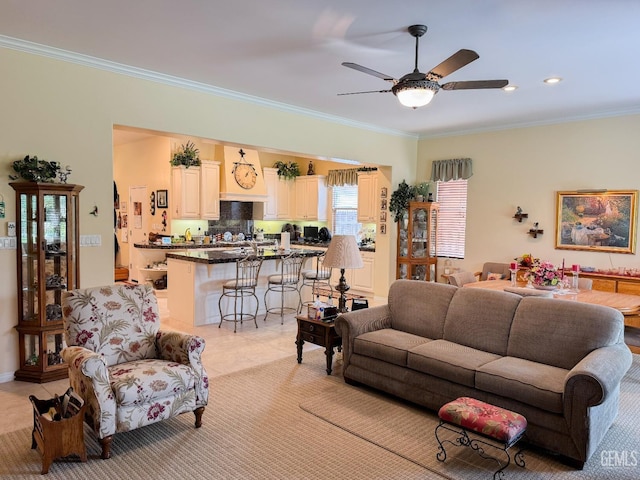 tiled living room with crown molding and ceiling fan