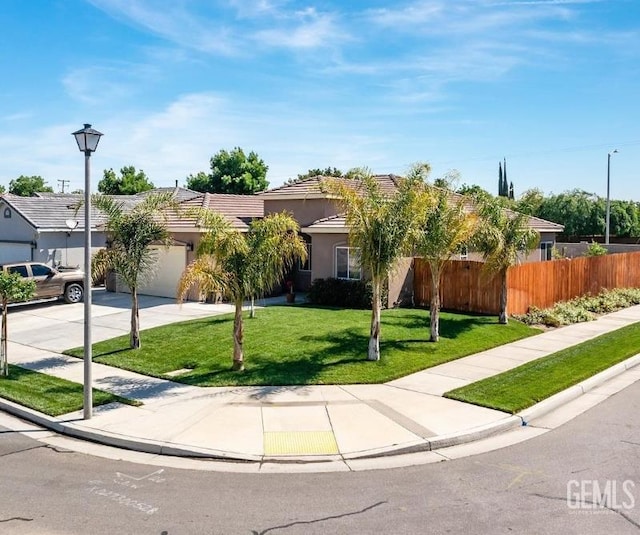 1756 Bautista Ave, Wasco, CA 93280 - view of property hidden behind natural elements featuring driveway, an attached garage, stucco siding, and a tiled roof