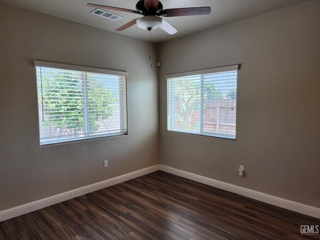 1756 Bautista Ave, Wasco, CA 93280 - spare room with plenty of natural light, a ceiling fan, and dark wood-type flooring