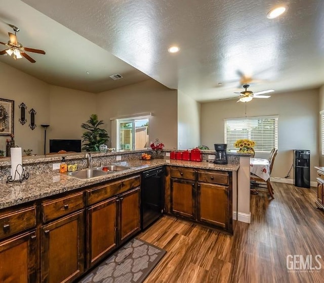 1756 Bautista Ave, Wasco, CA 93280 - kitchen with a ceiling fan, black dishwasher, dark wood-style floors, plenty of natural light, and recessed lighting
