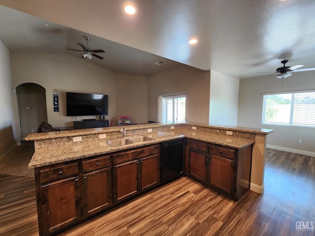 1756 Bautista Ave, Wasco, CA 93280 - kitchen featuring dishwasher, ceiling fan, open floor plan, light wood-type flooring, and arched walkways