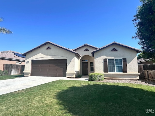 view of front of house with a garage, a front lawn, fence, stucco siding, and concrete driveway