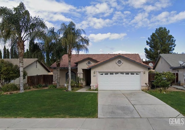 view of front of house featuring a garage and a front yard