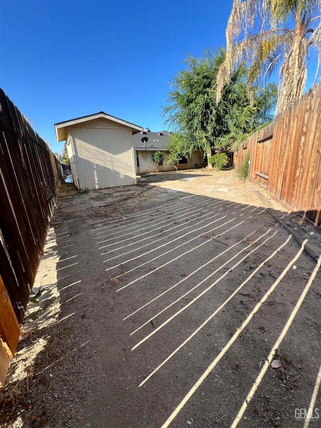 5306 Deville Ct, Bakersfield, CA 93308 - view of car parking with a fenced backyard