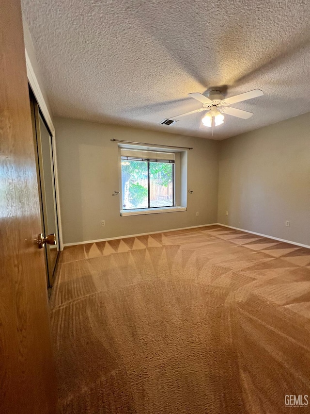 5306 Deville Ct, Bakersfield, CA 93308 - unfurnished bedroom with carpet flooring, a textured ceiling, a closet, and ceiling fan