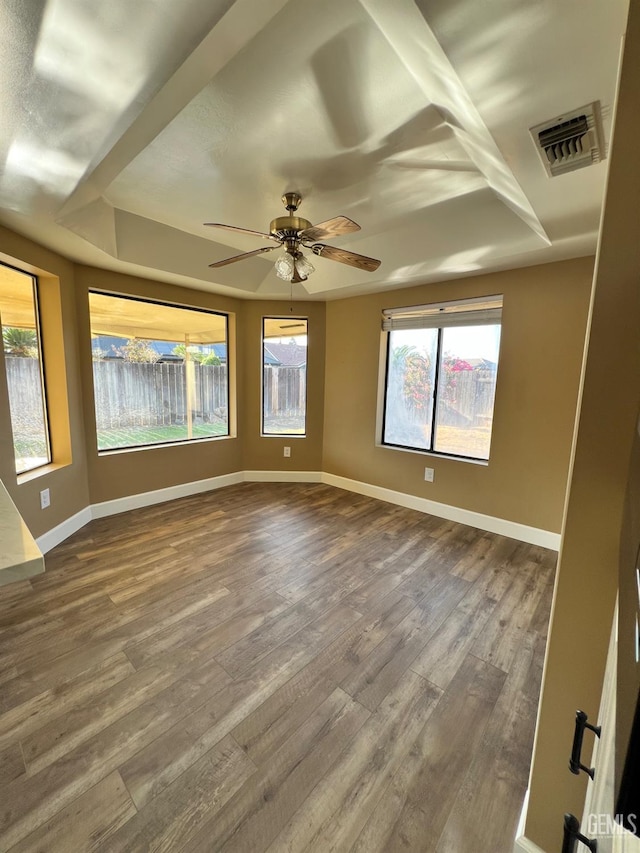5306 Deville Ct, Bakersfield, CA 93308 - spare room with dark wood-type flooring, ceiling fan, and a raised ceiling