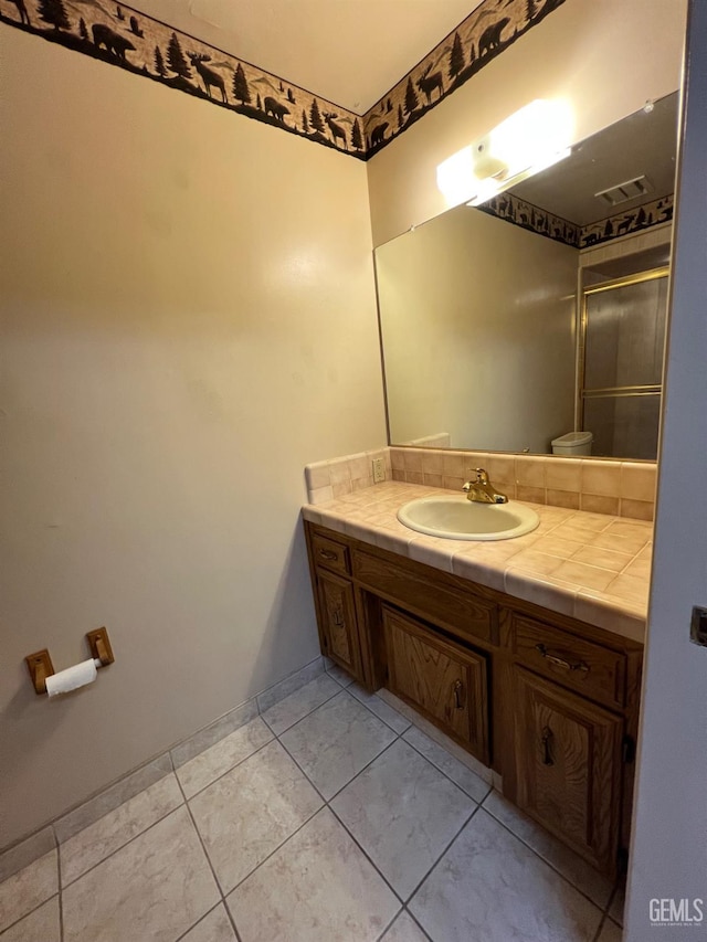 5306 Deville Ct, Bakersfield, CA 93308 - full bathroom featuring vanity and a shower with door