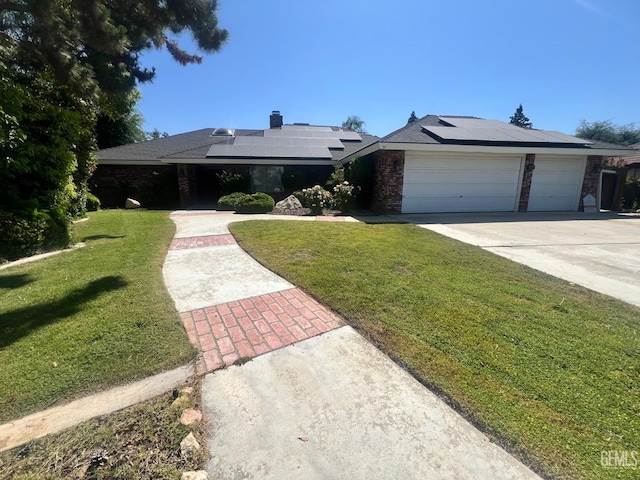 5306 Deville Ct, Bakersfield, CA 93308 - single story home featuring driveway, a front lawn, an attached garage, and solar panels