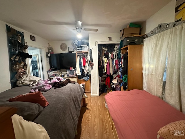 bedroom featuring ceiling fan and hardwood / wood-style flooring