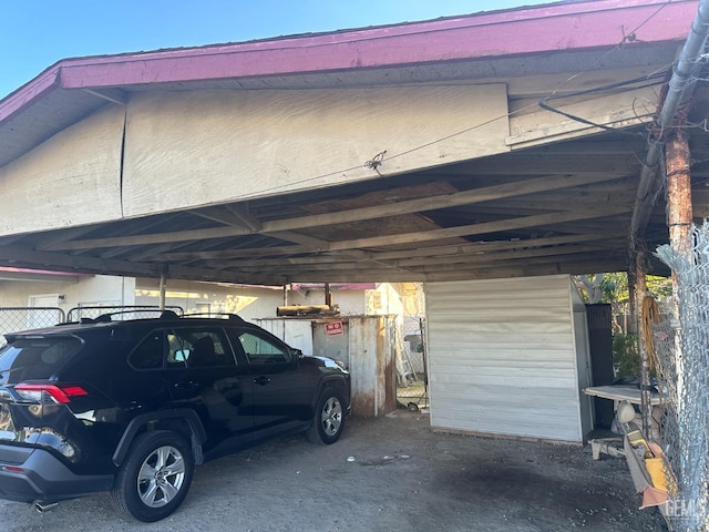 view of parking / parking lot featuring a carport