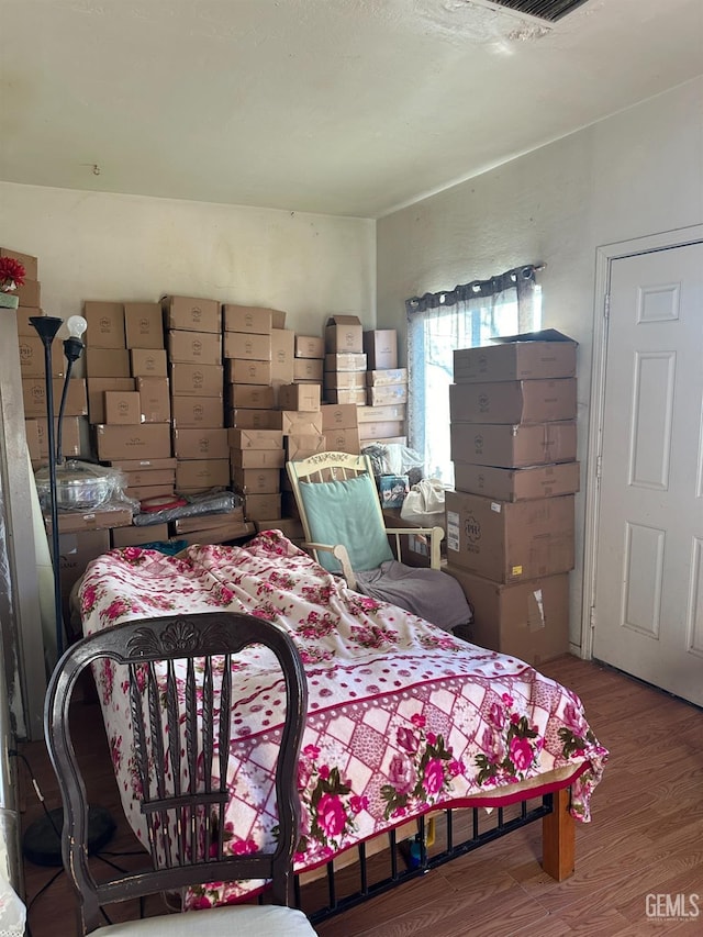 bedroom featuring wood-type flooring