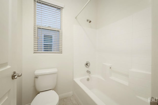 bathroom with tile patterned floors,  shower combination, and toilet